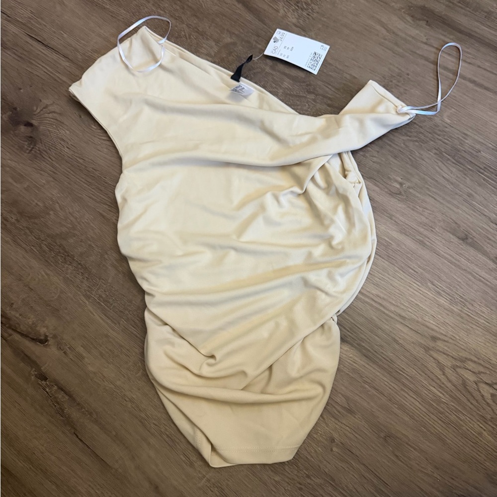 NWT Asymmetrical butter yellow top